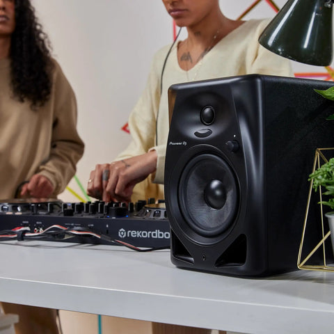 DM 50D BT 5 Inch Desktop Monitor System With Bluetooth for DJs, featuring compact design and dual sound modes on a tabletop