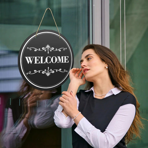 Woman beside door with Six Round Sublimation Door Hanger Blanks For DIY Wall Decor, 10 By 10 Inch MDF Wood Circles with rope.