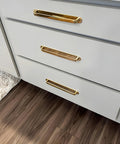 Solid Brass Cabinet Pull With Backplate, 6.5 Inch L-Shaped Handle In Polished Unlacquered Finish on bathroom drawers