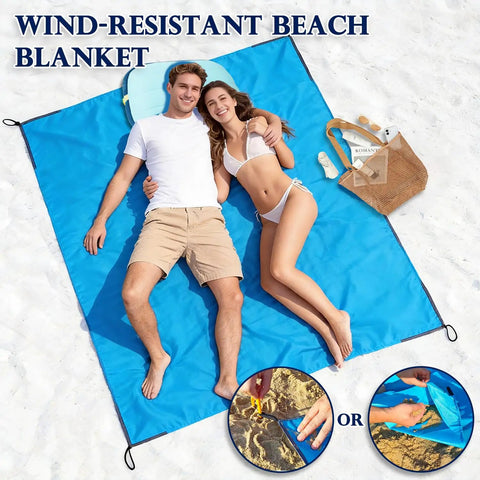 Portable 57x60 Inch Picnic Blanket Waterproof Sandproof Quick Dry Beach Mat with people lying on it and corner pockets visible