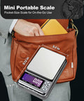 Ultra Portable Digital Coin Scale With Six Hundred Gram Capacity And Zero Point Zero One Gram Precision in a brown handbag.