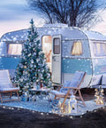 Festively lit vintage trailer with Christmas tree, using 2 Pack Outdoor Solar String Lights With 400 LEDs, 151 Feet, Waterproof.
