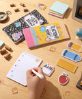 Two Pack Teacher Sticky Notes Gift Set With 560 Self Adhesive Notepads In 7 Styles Apple Ruler Pencil Designs on desk