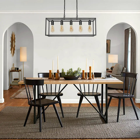 Modern Farmhouse Linear Chandelier In Matte Black For Kitchen Island And Dining Room above rustic dining table with candles.