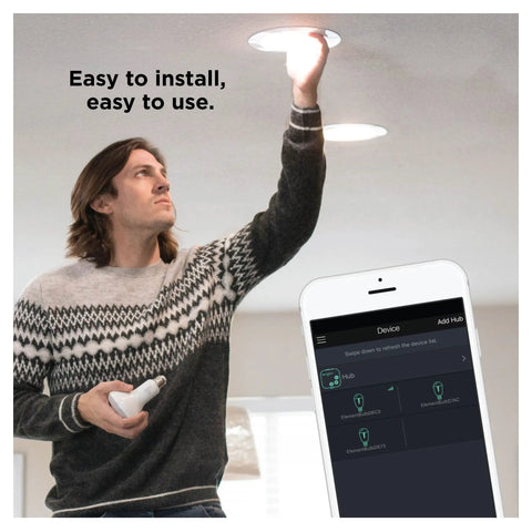 Person installing BR30 Dimmable Smart Flood Light Bulb, 650 Lumens, 9W, Soft White 2700K in a recessed ceiling can.