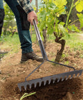 Person using Sturdy Metal Garden Rake With Extra Long Adjustable Handle 71 Inch 18 Inch Wide Head 14 Tines for yard work