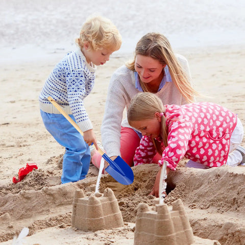 Two Pack Beach Shovels for Kids With 27.2 Inch Wood Handle Metal Spade Detachable Shovels for Sand Digging shown in use on the beach with children.