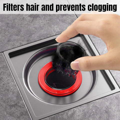 Hand removing debris from Odor Proof Floor Drain With Anti Odor Shield for Bathrooms and Kitchens Backflow Prevention Odor Dispersion Control Debris Catcher Fits 1.5 To 2 Inch Caliber Rust Resistant ABS And Silicone Magnetic Suspension Tech.
