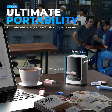 Label Printer PM220 Bluetooth Portable Thermal Printer For Small Biz With Tape 2-Inch Width For Address Logo And Clothing Labels, Smart AI App For iOS Android And PC, White shown on a cafe table with a laptop and coffee cup.