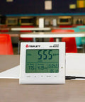 GSM200 Desktop Indoor Air Quality Monitor with CO2, humidity, temperature display in a cafeteria setting