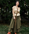 Badass Medieval Leather Belt For Renaissance Cosplay And Hella Cool Pirate Viking Props Featuring Embossed Buckle With Adjustable Waist Strap styled on a model in a green skirt and yellow top.