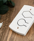 White Two Button Cover Plate For Garage Door Wall Station And Remote Opener Fits Classic Drive Quantum And Prodrive Openers Easy Five Minute Install With Minimal Button Movement To Prevent Breakage No Fuss on wooden surface
