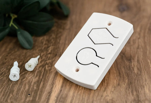 White Two Button Cover Plate For Garage Door Wall Station And Remote Opener Fits Classic Drive Quantum And Prodrive Openers Easy Five Minute Install With Minimal Button Movement To Prevent Breakage No Fuss on wooden surface