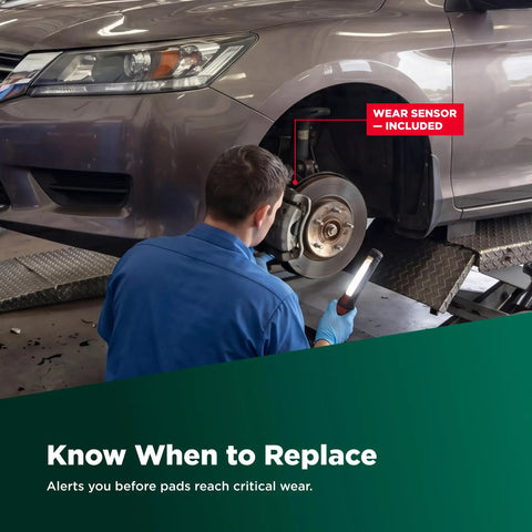 Mechanic inspecting Ceramic Front Disc Brake Pad Set EC1731 For Mitsubishi Mirage with wear sensor indicator visible