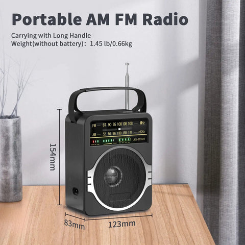 Front view of Portable AM FM Radio With Bluetooth Five Point Zero And Five Watt Loud Speaker, black finish, on wooden table.