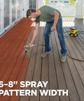 Person using High Efficiency Airless 313 Reversible Spray Tip for Sealers and Stains on deck, demonstrating 6 to 8 inch coverage.