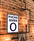 Heavy Duty Badass Zero Given Metal Sign For Man Cave Garage Wall Decor Rust Proof Vintage Bar Art 12x8 Inch on exposed brick wall.