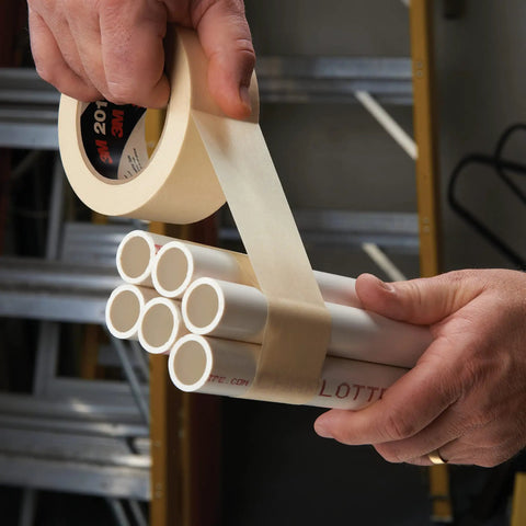 Light Duty General Use Masking Tape Tan Crepe Paper 1.42 In By 2.15 In With 4.4 Mil Adhesive wrapping white pipes indoors