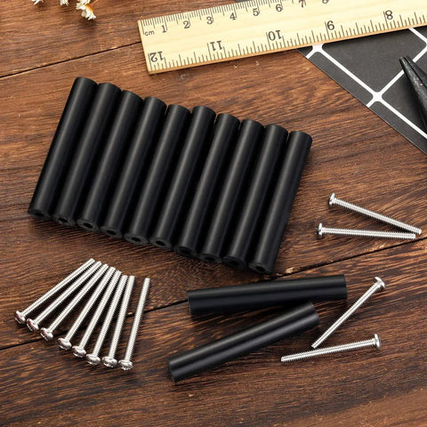Outlet Box Extender Kit For Electrical Switch And Receptacle Spacers 24 Pack Black Tubes And Screws on wooden surface