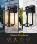 Built Tough Black Motion Sensor Outdoor Wall Light With Dusk Till Dawn Auto Sense And Built In Two Electrical Outlets For Plugging Yard Gear showing weather resistance in rain and shine.
