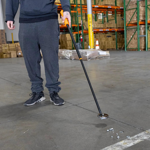 Person using Telescoping Magnetic Pickup Tool With 50 Pound Holding Power, 36.5 Inch Extendable Magnet Wand to pick up metal scraps