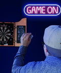 Game On Neon Sign For Gaming Setup Led Neon Light For Video Game Room Wall Decor Man Cave Bedroom Gift For Gamers Streamers Teens And Boys Yellow And Green above a dartboard