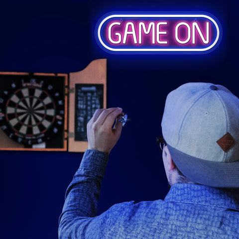 Game On Neon Sign For Gaming Setup Led Neon Light For Video Game Room Wall Decor Man Cave Bedroom Gift For Gamers Streamers Teens And Boys Yellow And Green above a dartboard
