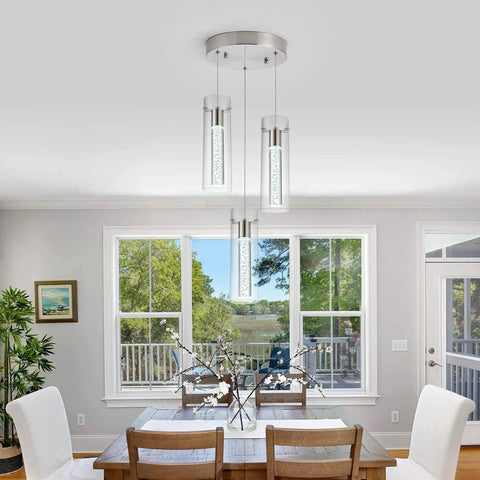 Brushed Nickel Crystal Pendant Light With Adjustable Rod hanging over dining room table, modern LED fixture, 8W 6000K Warm White