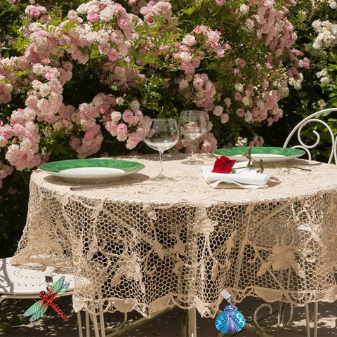 Eight Pack Colorful Butterfly Tablecloth Weights With Clips For Outdoor Parties Picnics And Backyard Dinners Durable Metal Clip Weights That Grip Tight And Stay Put Rust Resistant And Easy To Use on lace-covered garden table