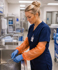 Orange 18 Inch Disposable Arm Sleeves Waterproof Polyethylene Covers With Elastic Ends For Food Processing Cleaning Packaging And Warehouse Use Pack Of 2000 on worker at sink