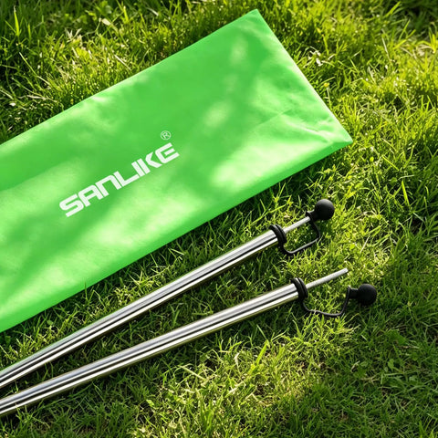 Adjustable Heavy Duty Tarp Poles Set Of 2 on grass with a green carrying bag, 90 Inch Telescoping Camping Poles For Tents, Stainless Steel