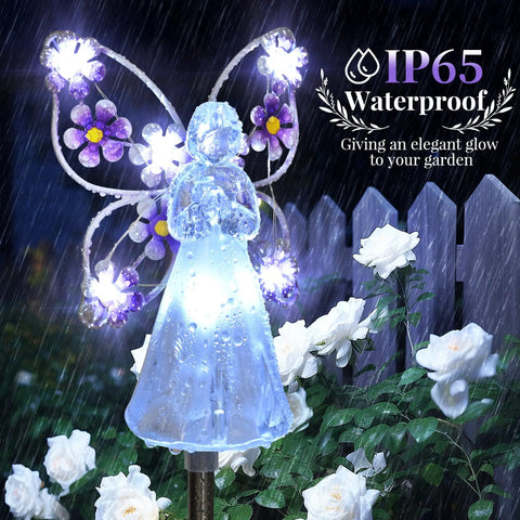 Solar Angel Garden Stake Lights 2 Pack With 7 LEDs for Cemetery Grave Decor Memorial Gift, glowing in a garden with flowers.