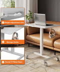 Mobile T Shaped Pneumatic Height Standing Desk with laptop on top in living room, features lockable wheels and storage hooks.