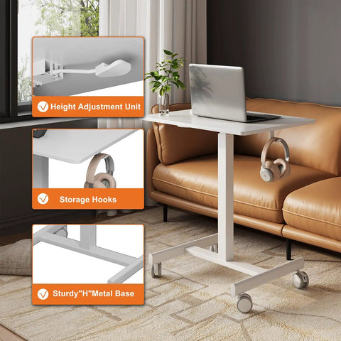 Mobile T Shaped Pneumatic Height Standing Desk with laptop on top in living room, features lockable wheels and storage hooks.
