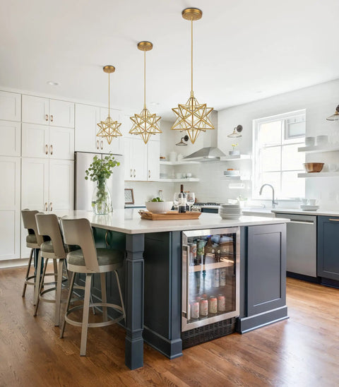 Modern Gold Moravian Star Pendant Light With Clear Glass Shade Adjustable in a kitchen setting