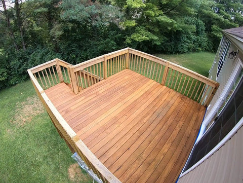 Aerial view of a wooden deck with Premium Semi Transparent Outdoor Wood Stain And Sealer In One For Decks Fences And Siding.