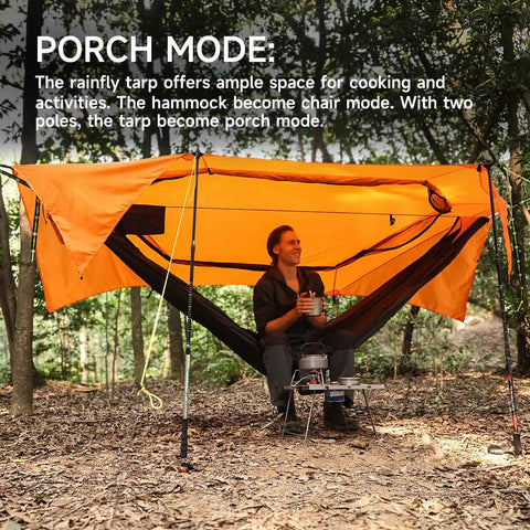 Camper enjoying UltraLight 11 Ft Hammock Shelter With Net And Rain Fly Tarp Four In One Camping Tent in porch mode in forest