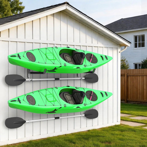 Built Like A Tank Wall Mount Kayak Storage Rack With Paddle Hooks, two green kayaks mounted on a white wall.
