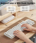Wireless Typewriter Style Mechanical Keyboard With Clicky Blue Switches And Crisp White Backlighting on desk for Mac and Windows.