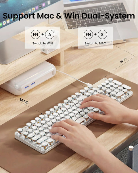 Wireless Typewriter Style Mechanical Keyboard With Clicky Blue Switches And Crisp White Backlighting on desk for Mac and Windows.