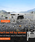 DJI Mini 2 Series Drone on rocky terrain with landing gear extensions from Accessories Kit.