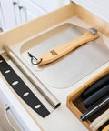Front view of OUII aluminum pizza peel with wooden handle, 12 x 14 inches.