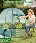 Person gardening using Galvanized Raised Garden Bed With Cover For Outdoors 4x4x1 Ft Metal Planter Box With PE Winter Cover And Mesh Summer Cover 3 In 1 Raised Bed With Windows For Easy Year Round Gardening
