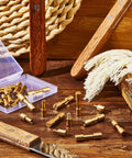Beefy Brass Bolt Fasteners Set, 20 Pieces, 6 mm Head Diameter Blind Rivets For Knife Making displayed with wooden handles and tools.