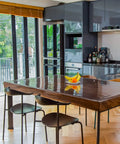 Dining room with wooden table covered by Clear Plastic Table Cover Protector for Tables and Desks, 36x72 Inches, 1.5mm Thick Vinyl Pad