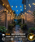 Warm White 33Ft 100 LED Connectable Globe String Lights With Remote for rainy outdoor decor in a garden pathway