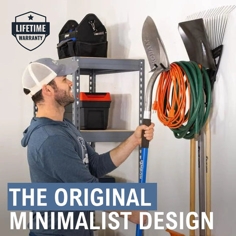 Person using Heavy Duty Garage Wall Mount Tool Hook Rack For Shovels Rakes Brooms Hoses And Cords Industrial Steel Powder Coated Design Holds Up To 50 Pounds Ultra Strong Yard And Workshop Organizer For Easy Access in garage