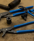 GripLock Tongue And Groove Pliers Set 6.5 Inch, 9.5 Inch, 12.5 Inch Water Pump Pliers with Permalock Fastener on workshop table