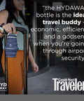 Traveler holding 25oz Collapsible Travel Water Bottle With Leakproof Flip Top Lid BPA Free attached to suitcase handle