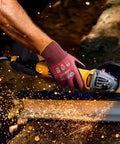 Person using cut resistant nitrile coated work gloves with firm grip ANSI A4 palm dip for dry oily parts in woodworking